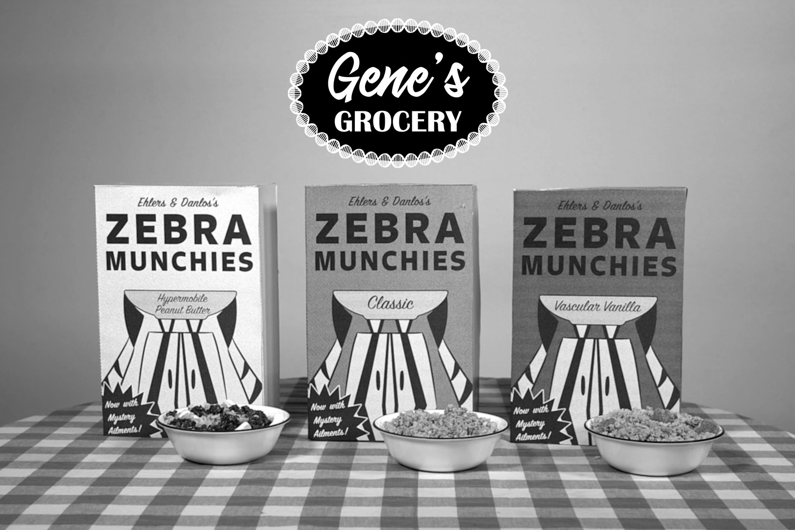 All three Zebra Munchies boxes on a table with cereal in front of them. Above is the "Gene's Grocery" logo